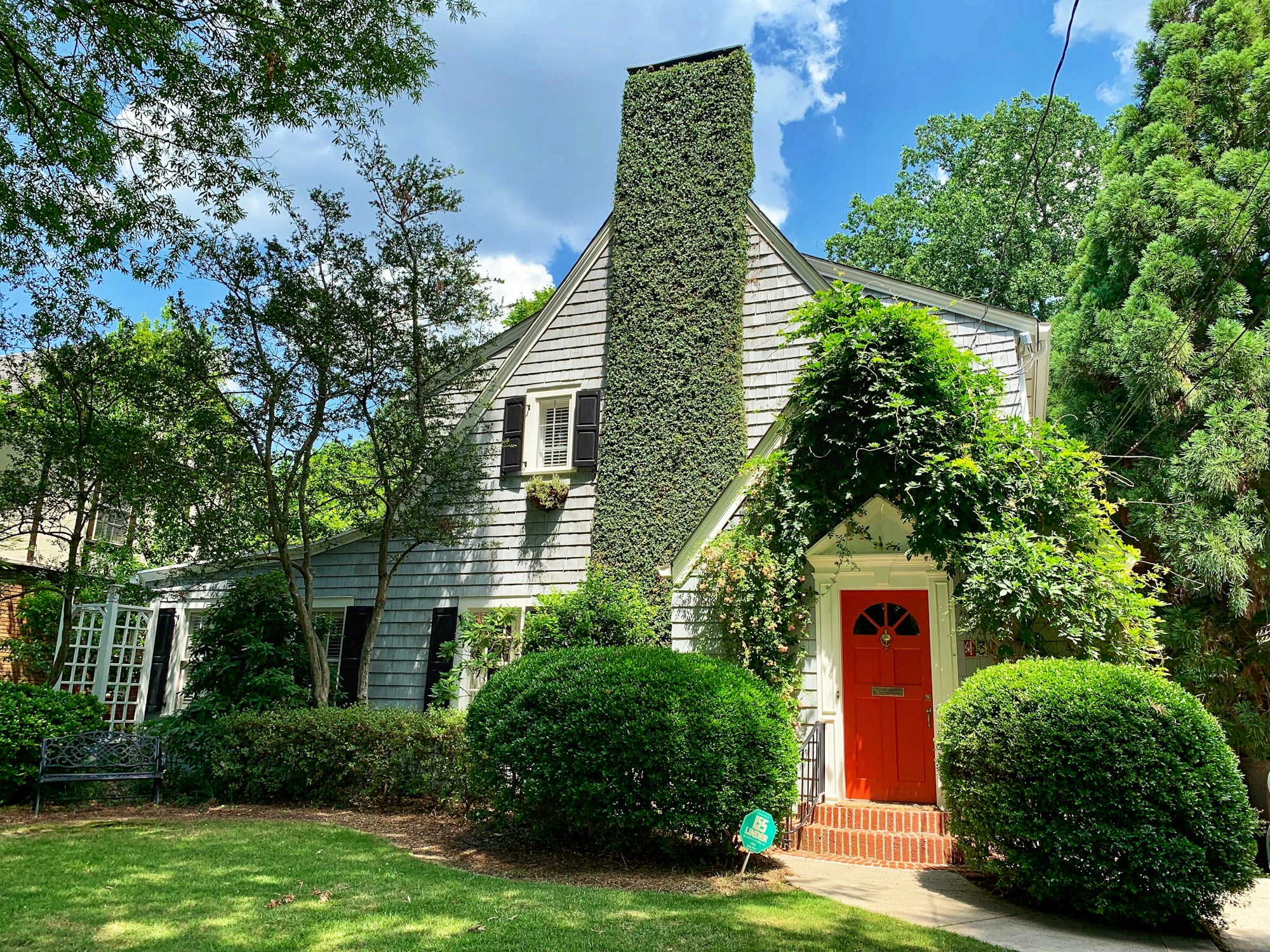 Atlanta home with a welcoming front entrance and green garden